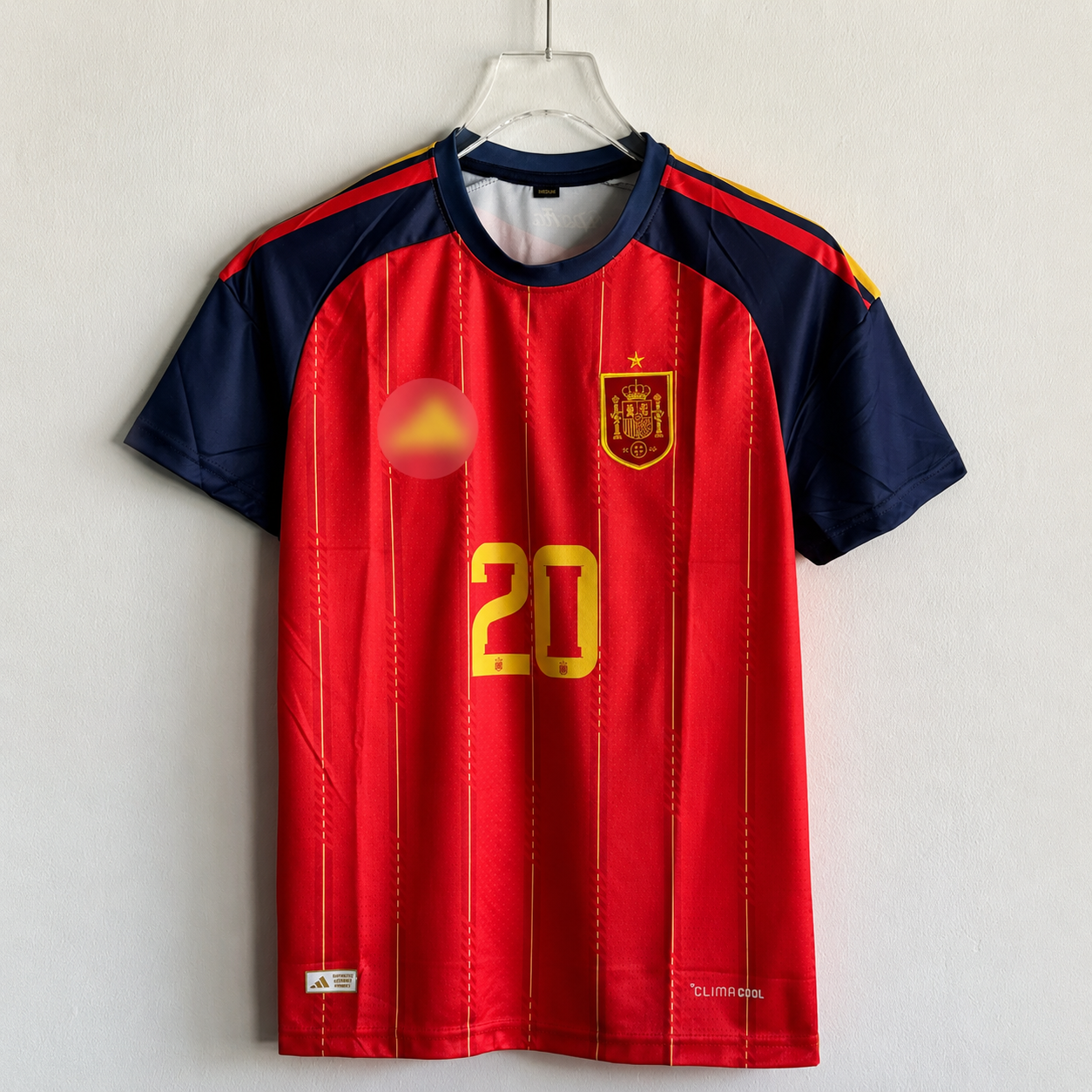 Red and navy sports jersey with yellow number 20 on a white background