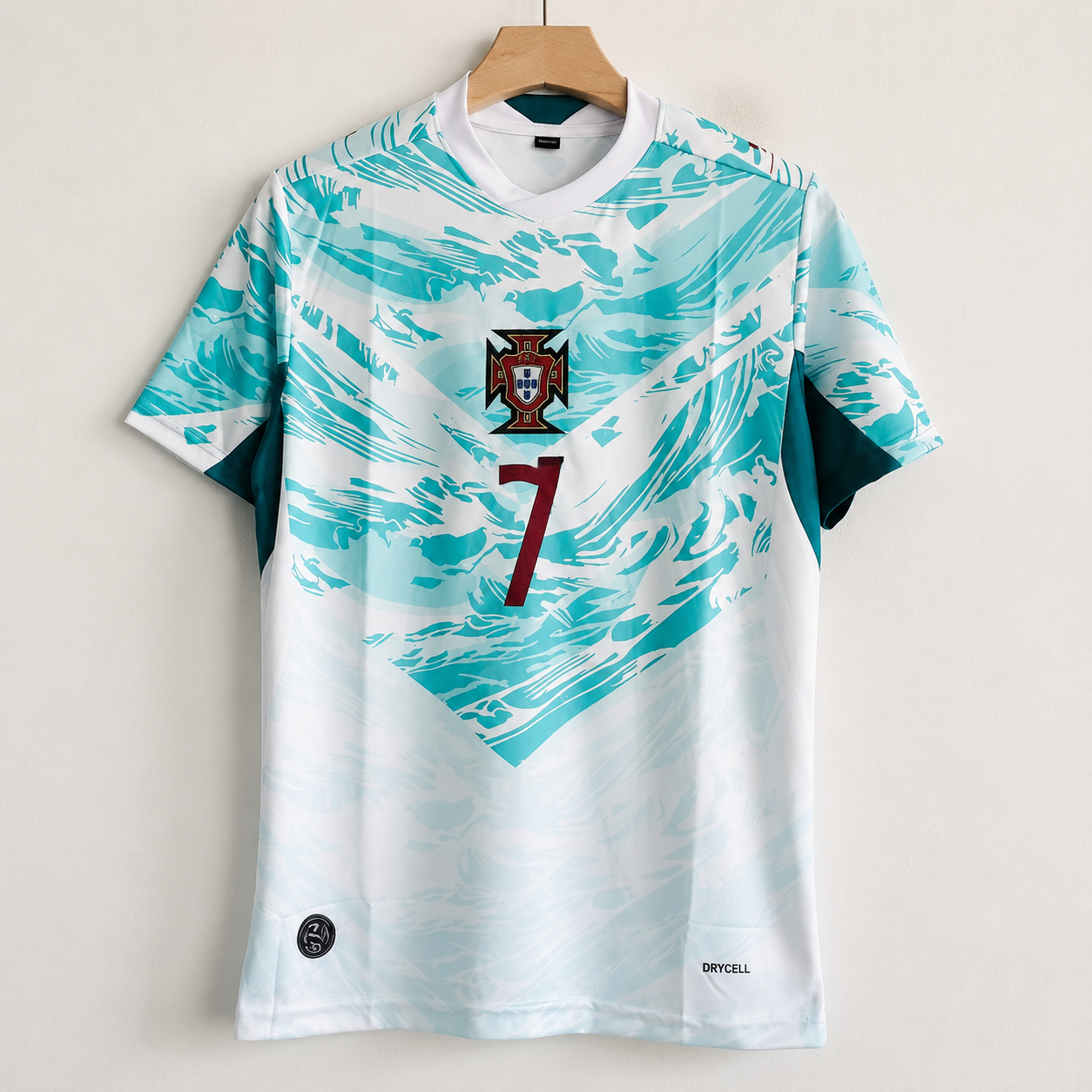Soccer jersey with a design and number on a hanger against a light background