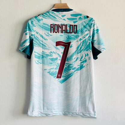White sports jersey with blue patterns and 'Ronaldo' and number '7' on a hanger against a light background